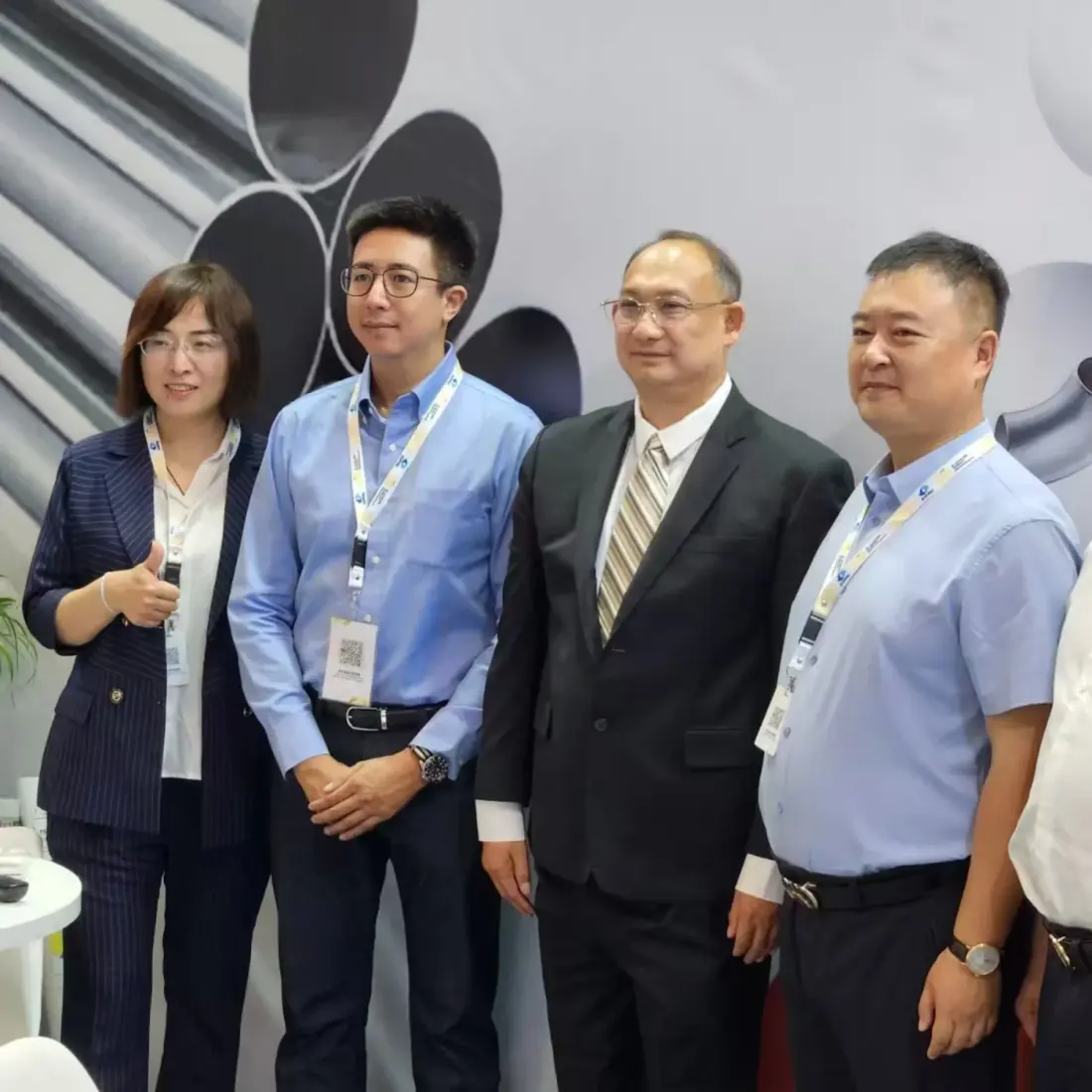 Sales team and industry customers at a trade show booth